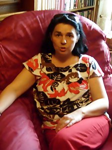 Adorable aged mama is walking on the street