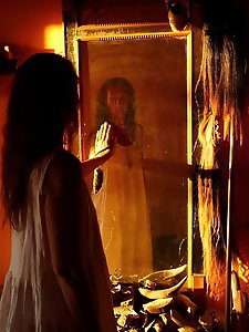 An amazing old lady is posing almost naked in stunning shots