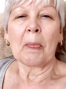 Insatiable dame is taking off her bra for a photoshoot