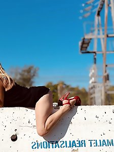 Awesome-looking older housewife is posing at home