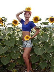 Aged girlfriend is posing undressed on the street